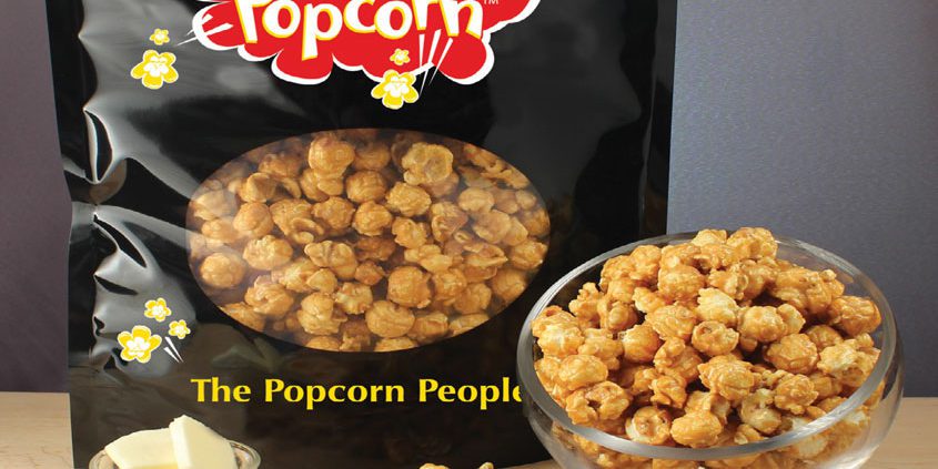 A bowl of Flippin' Popcorn with caramel and peanut flavors.